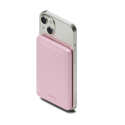 Cygnett Magnetic Wireless Power Bank 5K attached to iPhone, pink, HD product photo